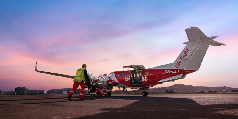 Crewperson Steve loading patient into Air Ambulance Plane